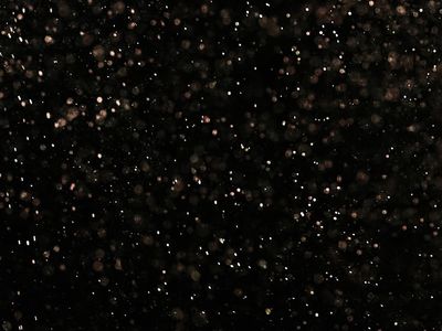 Abstract image representing airflow and breathing with soft light particles.